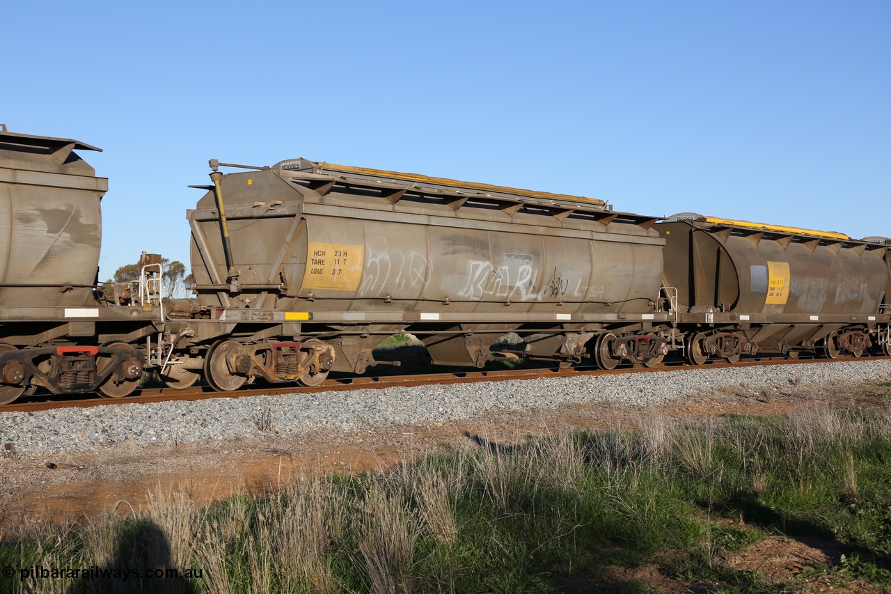 130703 0289
Kaldow, HCN type bogie grain hopper waggon HCN 23, originally an NHB type hopper built by Tulloch Ltd for the Commonwealth Railways North Australia Railway. One of forty rebuilt by Islington Workshops 1978-79 to the HCN type with a 36 ton rating, increased to 40 tonnes in 1984. Seen here loaded with grain with a Moose Metalworks roll-top cover.
Keywords: HCN-type;HCN23;SAR-Islington-WS;rebuild;Tulloch-Ltd-NSW;NHB-type;NHB1584;