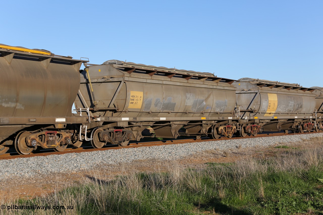 130703 0296
Kaldow, HCN type bogie grain hopper waggon HCN 31, originally an NHB type hopper built by Tulloch Ltd for the Commonwealth Railways North Australia Railway. One of forty rebuilt by Islington Workshops 1978-79 to the HCN type with a 36 ton rating, increased to 40 tonnes in 1984. Seen here loaded with grain with a Moose Metalworks roll-top cover.
Keywords: HCN-type;HCN31;SAR-Islington-WS;rebuild;Tulloch-Ltd-NSW;NHB-type;NHB1579;