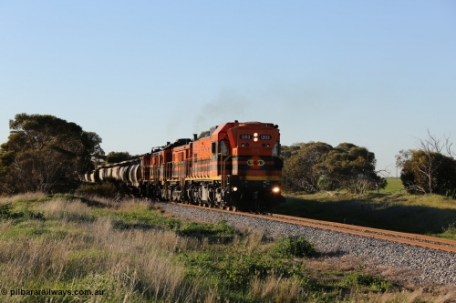 130703 0250
Kaldow, running south with the sun behind it is 1200 class 1204 a Clyde Engineering built EMD G12C model with serial 65-428 leading two ALCo units and was originally built in 1965 for Western Mining Corporation and operated by the WAGR as their A class A 1513. It came to the Eyre Peninsula in October 2004. [url=https://goo.gl/maps/FnDpXh45LbN7scrt5]Geo location[/url]. July 3, 2006.
Keywords: 1200-class;1203;Clyde-Engineering-Granville-NSW;EMD;G12C;65-427;A-class;A1513;