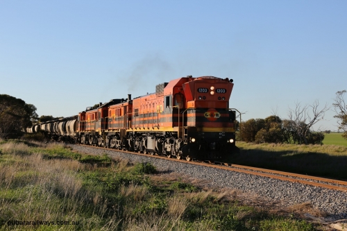 130703 0255
Kaldow, running south with the sun behind it is 1200 class 1204 a Clyde Engineering built EMD G12C model with serial 65-428 leading two ALCo units and was originally built in 1965 for Western Mining Corporation and operated by the WAGR as their A class A 1513. It came to the Eyre Peninsula in October 2004. [url=https://goo.gl/maps/FnDpXh45LbN7scrt5]Geo location[/url]. July 3, 2006.
Keywords: 1200-class;1203;Clyde-Engineering-Granville-NSW;EMD;G12C;65-427;A-class;A1513;