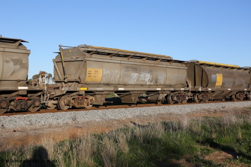 130703 0289
Kaldow, HCN type bogie grain hopper waggon HCN 23, originally an NHB type hopper built by Tulloch Ltd for the Commonwealth Railways North Australia Railway. One of forty rebuilt by Islington Workshops 1978-79 to the HCN type with a 36 ton rating, increased to 40 tonnes in 1984. Seen here loaded with grain with a Moose Metalworks roll-top cover.
Keywords: HCN-type;HCN23;SAR-Islington-WS;rebuild;Tulloch-Ltd-NSW;NHB-type;NHB1584;