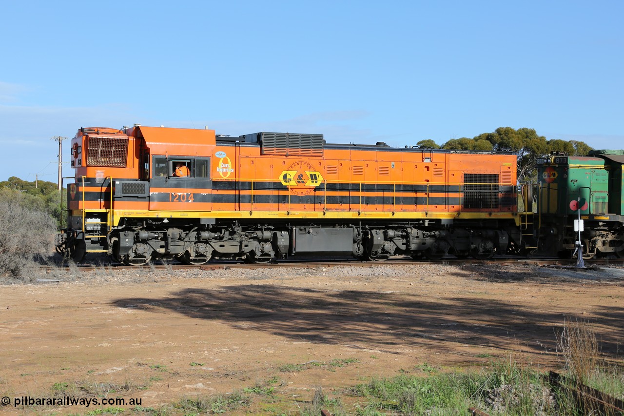 130704 0376
Kyancutta, 1200 class unit 1204 wearing current owner Genesee & Wyoming livery is a Clyde Engineering built EMD G12C model with serial 65-428 was originally built in 1965 for Western Mining Corporation and operated by the WAGR as their A class A 1514 recoded to 1204 in April 2004 and to the Eyre Peninsula in July 2004.
Keywords: 1200-class;1204;Clyde-Engineering-Granville-NSW;EMD;G12C;65-428;A-class;A1514;