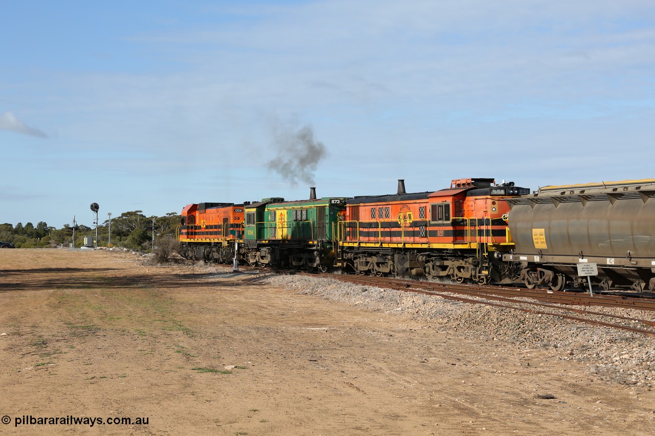 130704 0394
Kyancutta, south bound loaded grain train has stopped here to collect a loaded rack of grain waggons, seen here running out of the 'new grain siding' added in 1970 behind EMD 1204 and twin ALCo 830 units 873 and 851. 4th July 2013.
Keywords: 830-class;851;AE-Goodwin;ALCo;DL531;84137;