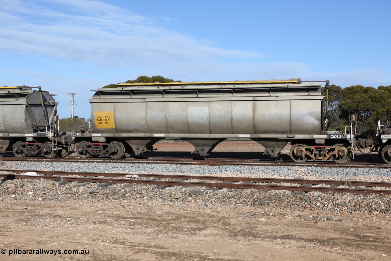 130704 0400
Kyancutta, HCN type bogie grain hopper waggon HCN 17, originally an NHB type hopper built by Tulloch Ltd for the Commonwealth Railways North Australia Railway. One of forty rebuilt by Islington Workshops 1978-79 to the HCN type with a 36 ton rating, increased to 40 tonnes in 1984. Seen here loaded with grain with a Moose Metalworks roll-top cover.
Keywords: HCN-type;HCN17;SAR-Islington-WS;rebuild;Tulloch-Ltd-NSW;NHB-type;NHB1016;