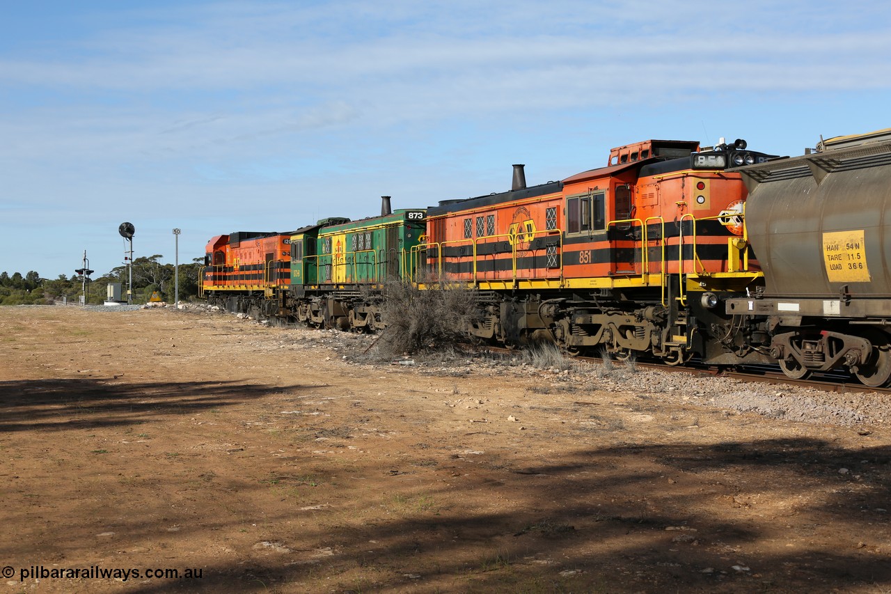 130704 0416
Kyancutta, south bound loaded grain train has stopped here to collect a loaded rack of grain waggons, seen here backing up to re-join the rest of the train on the mainline with one of only three electric signals on the network which a sharp eye might notice has turned green, behind EMD 1204 and twin ALCo 830 units 873 and 851. 4th July 2013.
Keywords: 830-class;851;AE-Goodwin;ALCo;DL531;84137;