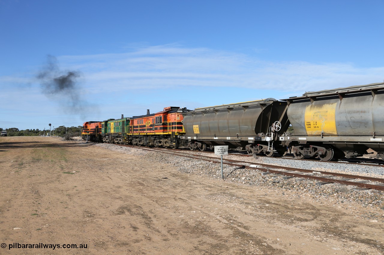 130704 0421
Kyancutta, south bound loaded grain train has stopped here to collect a loaded rack of grain waggons, seen here backing up to re-join the rest of the train on the mainline with one of only three electric signals on the network with the original goods siding closest to the camera, behind EMD 1204 and twin ALCo 830 units 873 and 851. 4th July 2013.
Keywords: HAN-type;HAN54;1969-73/68-54;SAR-Islington-WS;