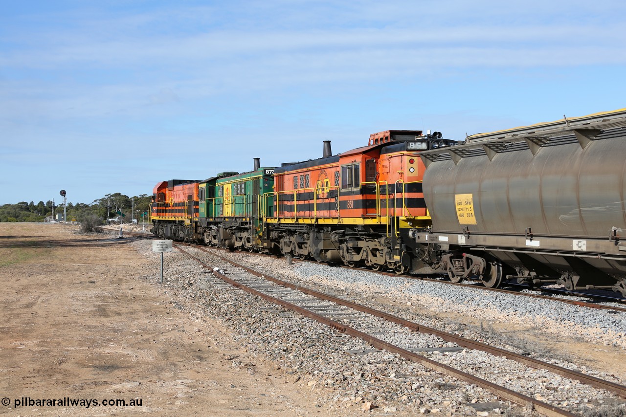 130704 0422
Kyancutta, south bound loaded grain train has stopped here to collect a loaded rack of grain waggons, seen here backing up to re-join the rest of the train on the mainline with one of only three electric signals on the network with the original goods siding closest to the camera, behind EMD 1204 and twin ALCo 830 units 873 and 851. 4th July 2013.
Keywords: 830-class;851;AE-Goodwin;ALCo;DL531;84137;