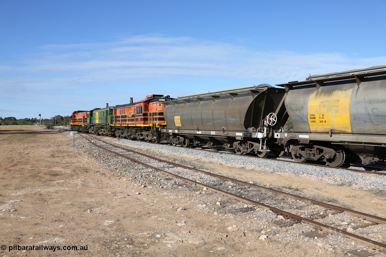 130704 0423
Kyancutta, south bound loaded grain train has stopped here to collect a loaded rack of grain waggons, seen here backing up to re-join the rest of the train on the mainline with one of only three electric signals on the network with the original goods siding closest to the camera, behind EMD 1204 and twin ALCo 830 units 873 and 851. 4th July 2013.
Keywords: HAN-type;HAN54;1969-73/68-54;SAR-Islington-WS;