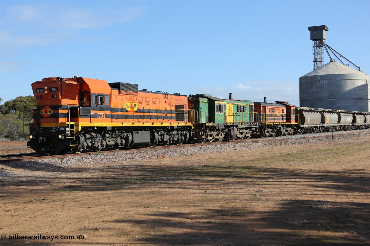 130704 0438
Kyancutta, 1200 class unit 1204 wearing current owner Genesee & Wyoming livery is a Clyde Engineering built EMD G12C model with serial 65-428 heads up a loaded grain train as it undertakes a brake test following shunting to attach a further fourteen waggons. 4th July 2013.
Keywords: 1200-class;1204;Clyde-Engineering-Granville-NSW;EMD;G12C;65-428;A-class;A1514;