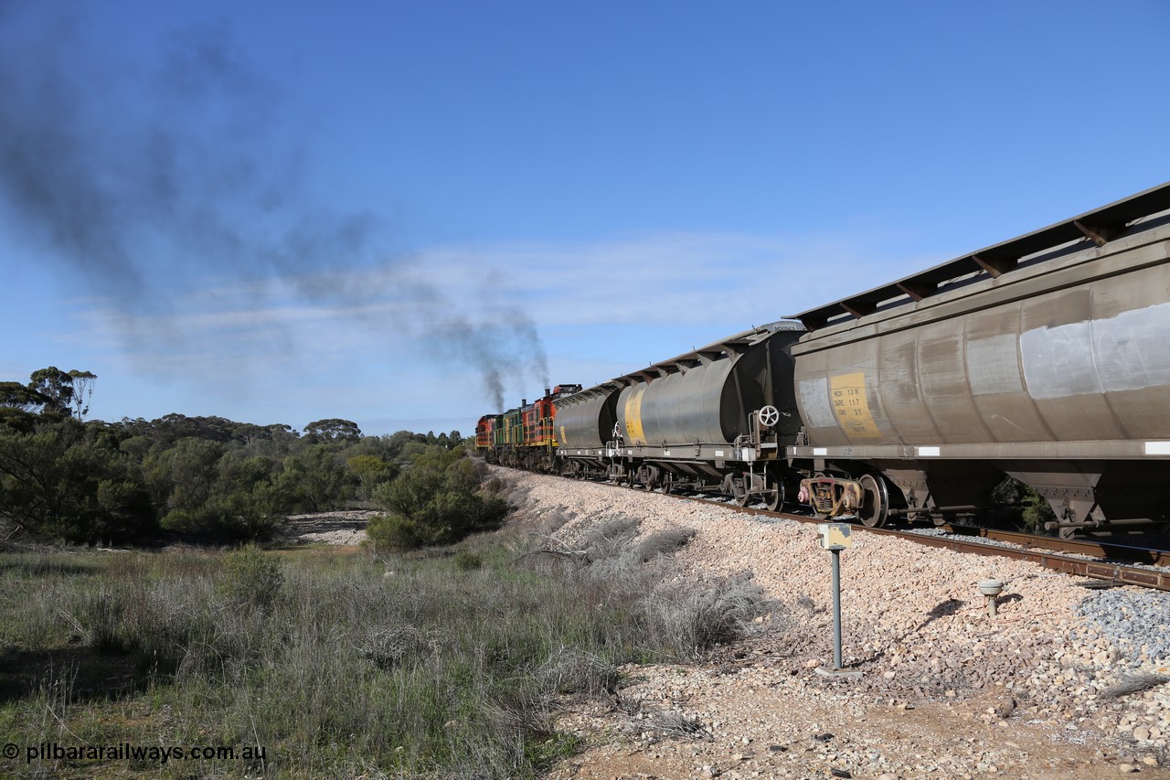 130704 0451
Kyancutta, as the train powers away south two examples of the SAR built HAN type of bogie grain waggons lead the front of the rake, sixty eight units were built by South Australian Railways Islington Workshops between 1969 and 1973 for the Eyre Peninsula system with the third waggon being an HCN type converted by SAR Islington Workshops between 1978-79 from Tulloch Ltd NSW built NHB type iron ore waggons. 4th July 2013.
Keywords: HAN-type;HAN7;1969-73/68-7;SAR-Islington-WS;