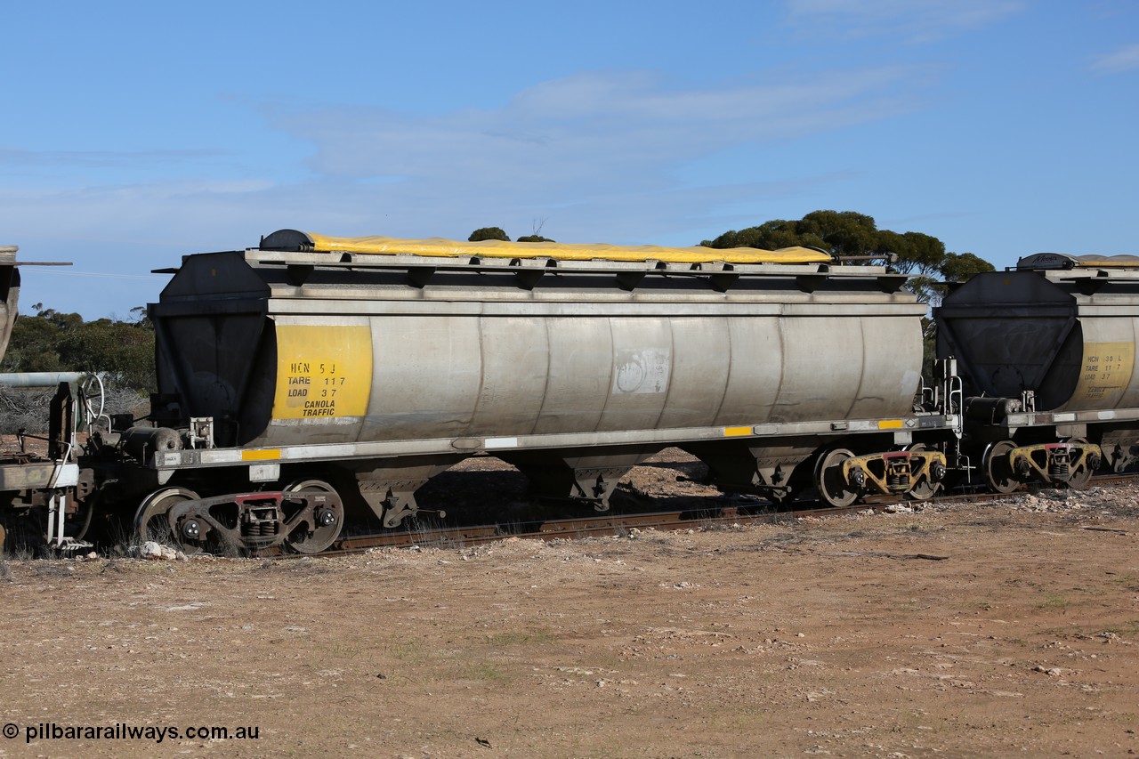 130704 0472
Kyancutta, HCN type bogie grain hopper waggon HCN 5, originally an NHB type hopper built by Tulloch Ltd for the Commonwealth Railways North Australia Railway. One of forty rebuilt by Islington Workshops 1978-79 to the HCN type with a 36 ton rating, increased to 40 tonnes in 1984. Seen here loaded with grain with a Moose Metalworks roll-top cover.
Keywords: HCN-type;HCN5;SAR-Islington-WS;rebuild;Tulloch-Ltd-NSW;NHB-type;NHB1008;