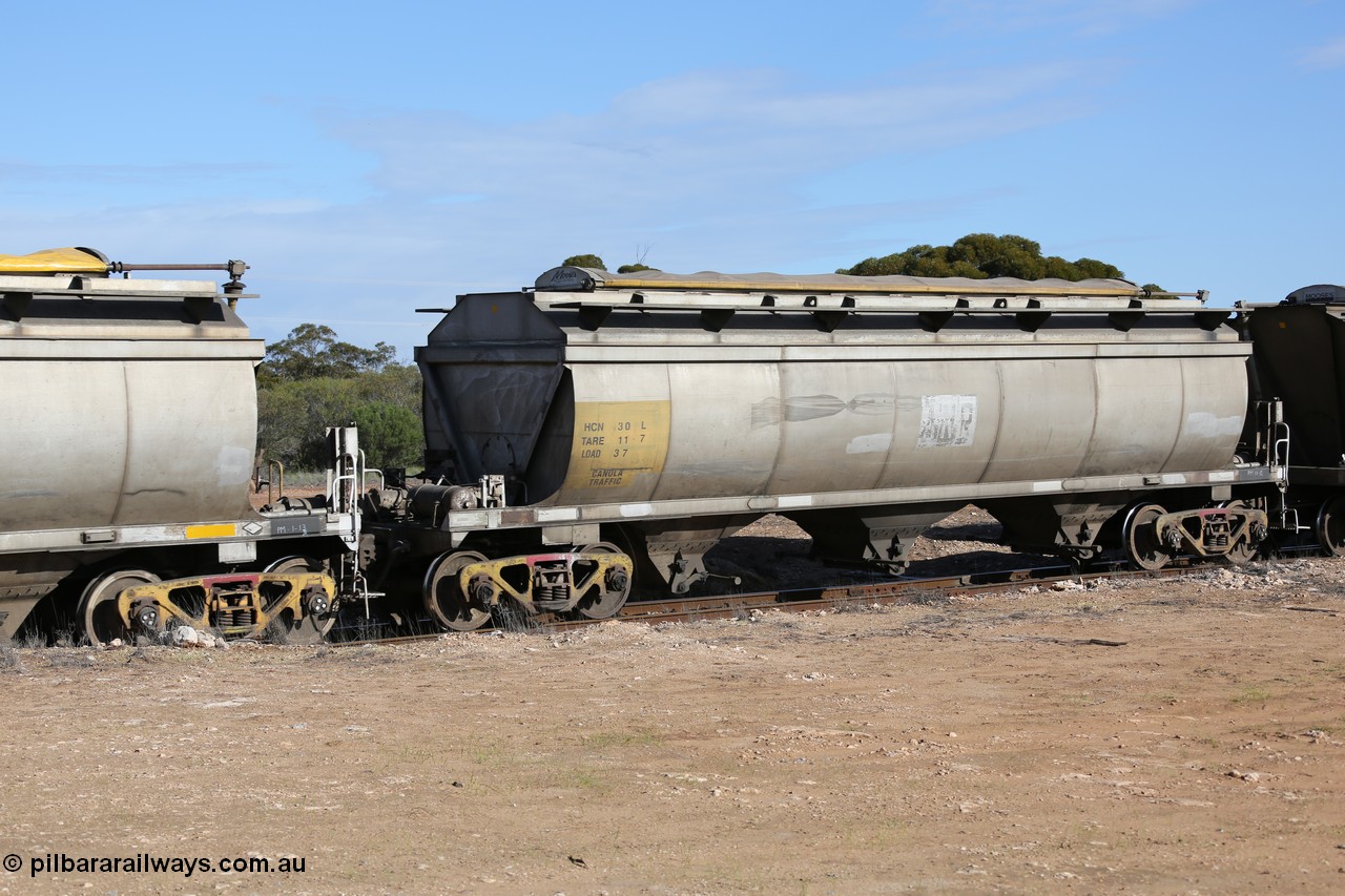 130704 0473
Kyancutta, HCN type bogie grain hopper waggon HCN 30, originally an NHB type hopper built by Tulloch Ltd for the Commonwealth Railways North Australia Railway. One of forty rebuilt by Islington Workshops 1978-79 to the HCN type with a 36 ton rating, increased to 40 tonnes in 1984. Seen here loaded with grain with a Moose Metalworks roll-top cover.
Keywords: HCN-type;HCN30;SAR-Islington-WS;rebuild;Tulloch-Ltd-NSW;NHB-type;NHB1593;