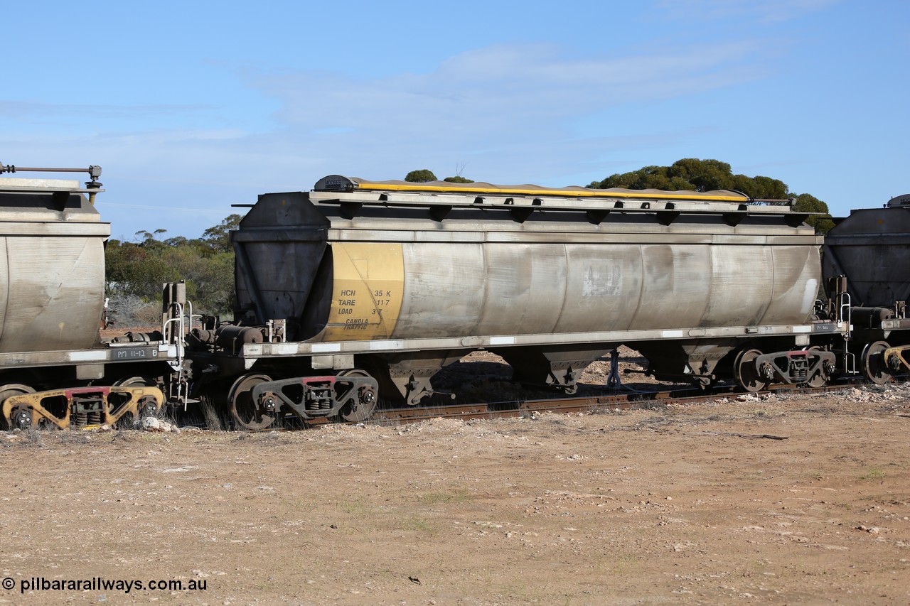 130704 0479
Kyancutta, HCN type bogie grain hopper waggon HCN 35, originally an NHB type hopper built by Tulloch Ltd for the Commonwealth Railways North Australia Railway. One of forty rebuilt by Islington Workshops 1978-79 to the HCN type with a 36 ton rating, increased to 40 tonnes in 1984. Seen here loaded with grain with a Moose Metalworks roll-top cover.
Keywords: HCN-type;HCN35;SAR-Islington-WS;rebuild;Tulloch-Ltd-NSW;NHB-type;NHB1582;