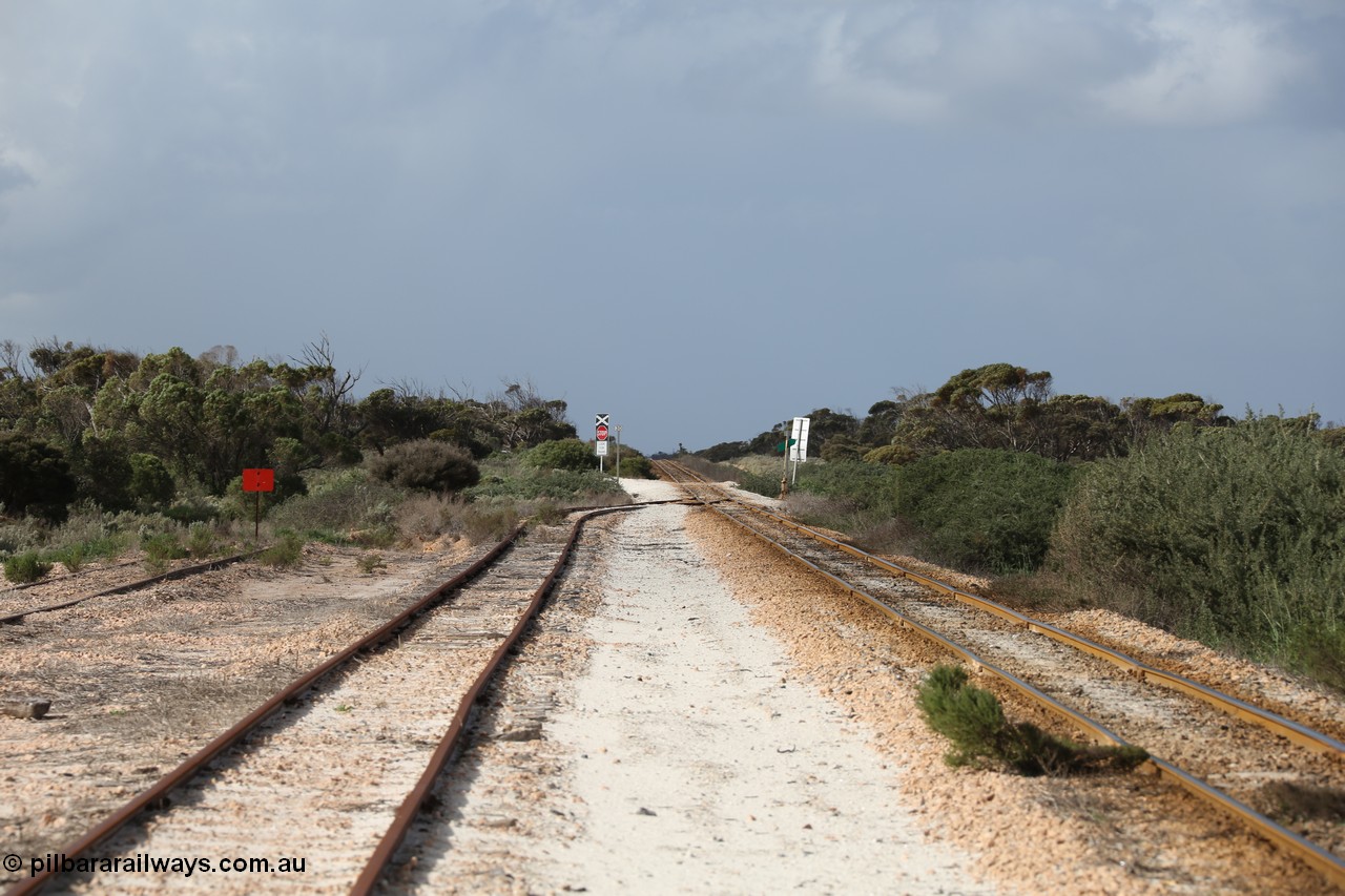 130704 0487
Moule, looking east, Moule located at the 445.6 km was opened in February 1966 when the Direct Line between Ceduna and Kevin was opened. From the left is the end of the ballast siding with the crossing loop rejoining the mainline just before the grade crossing to access the ballast stockpile area. [url=https://goo.gl/maps/KTtpy7LJB4tmHaTt6]Location is here[/url]. 4th July 2013.
