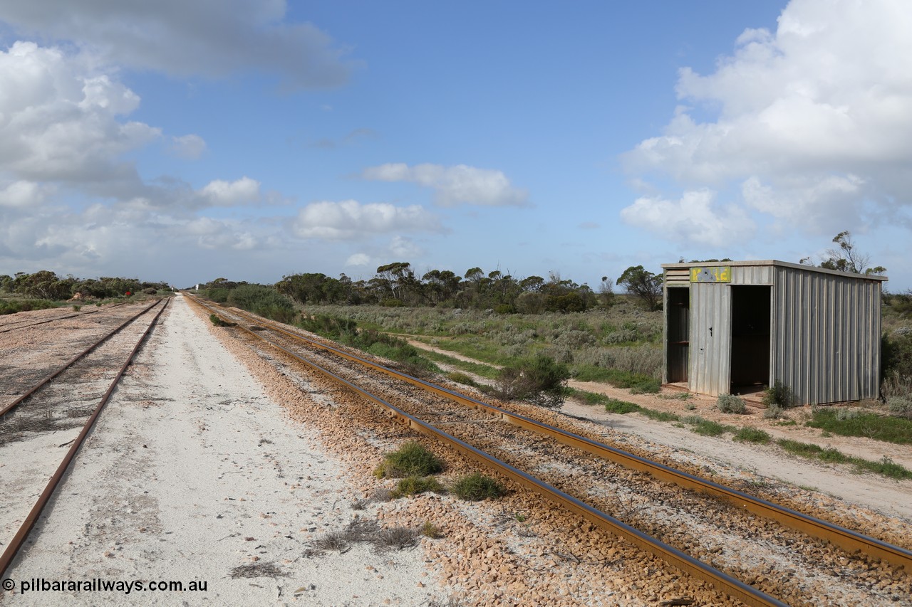 130704 0488
Moule, yard overview looking east, Moule located at the 445.6 km was opened in February 1966 when the Direct Line between Ceduna and Kevin was opened. From the left is the end of the ballast siding with the crossing loop rejoining the mainline just before the grade crossing to access the ballast stockpile area. [url=https://goo.gl/maps/KTtpy7LJB4tmHaTt6]Location is here[/url]. 4th July 2013.
