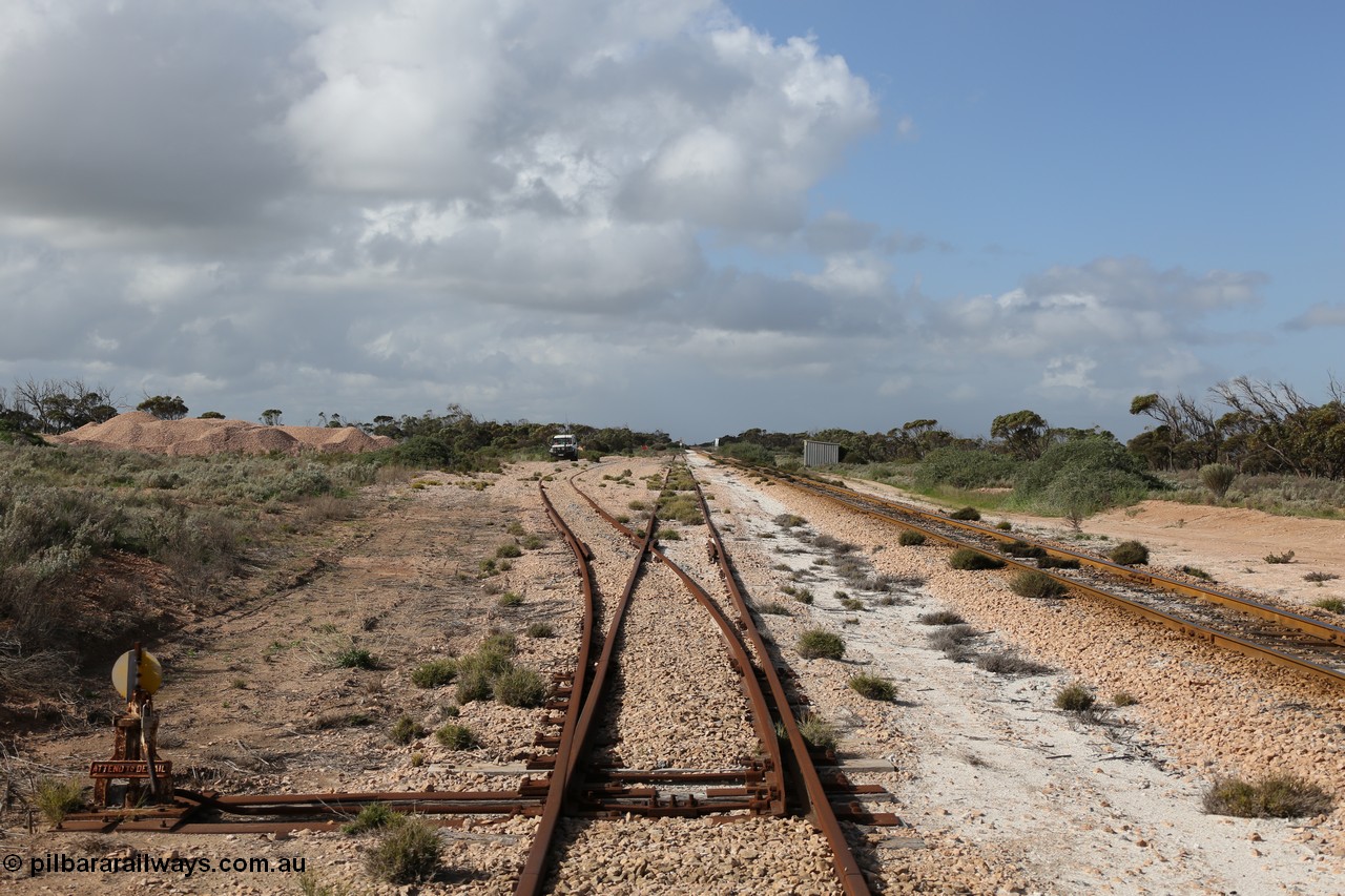 130704 0493
Moule, yard view looking east from the points for the single ended ballast siding with ballast pile of the left. Moule located at the 445.6 km was opened in February 1966 when the Direct Line between Ceduna and Kevin was opened. It hosts a crossing loop and ballast loading siding, [url=https://goo.gl/maps/14Xf9VRbSC6hkoQz5]Location is here[/url]. 4th July 2013.
