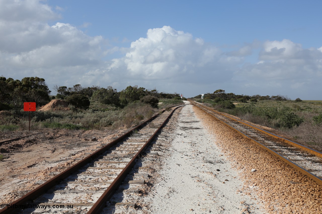 130704 0499
Moule, looking east, Moule located at the 445.6 km was opened in February 1966 when the Direct Line between Ceduna and Kevin was opened. From the left is the end of the ballast siding with the crossing loop rejoining the mainline just before the grade crossing to access the ballast stockpile area. [url=https://goo.gl/maps/6J6z67u4tB7HJBcDA]Location is here[/url]. 4th July 2013.
