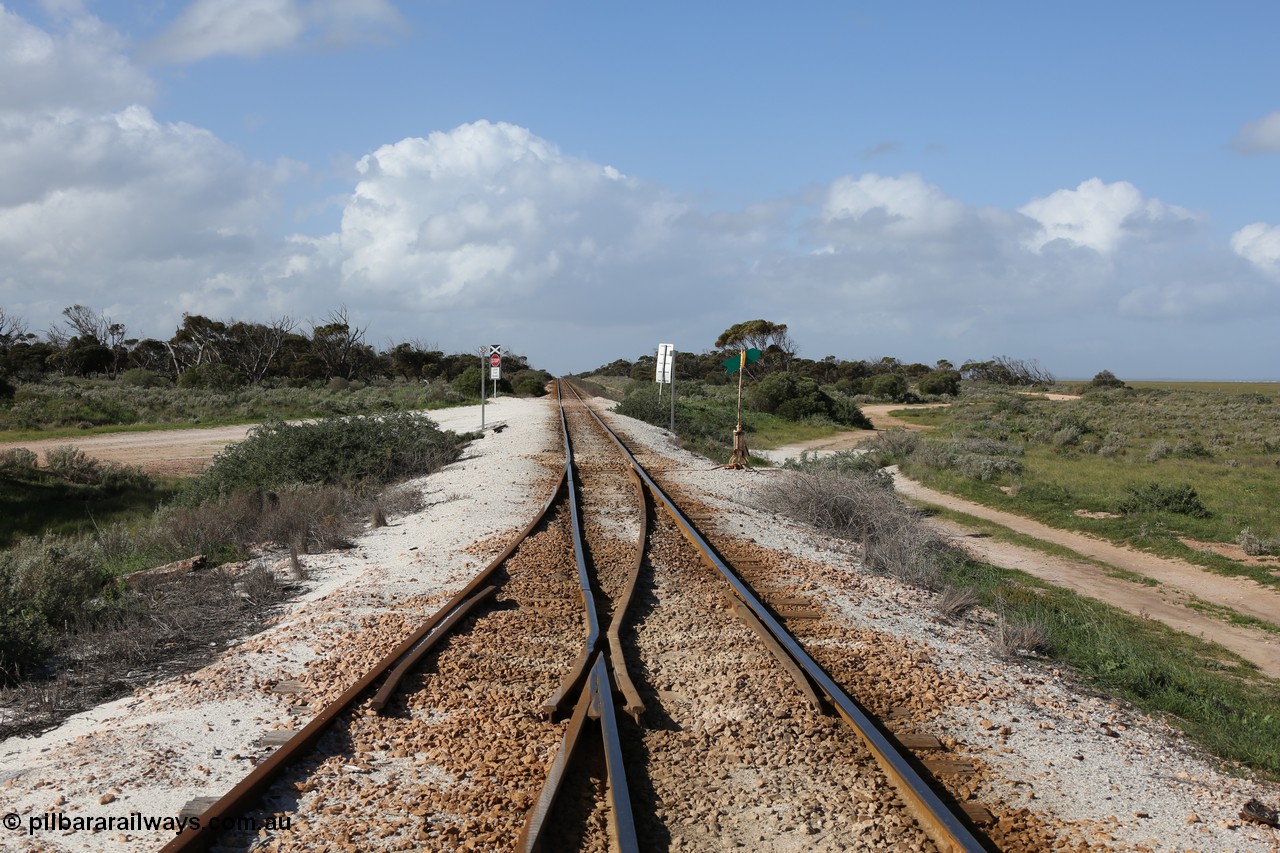 130704 0500
Moule, looking east at the east end points for the crossing loop, grade crossing is for access to ballast stockpile area, Moule located at the 445.6 km was opened in February 1966 when the Direct Line between Ceduna and Kevin was opened. [url=https://goo.gl/maps/oQR5WeuKACFTMBKC9]Location is here[/url]. 4th July 2013.
