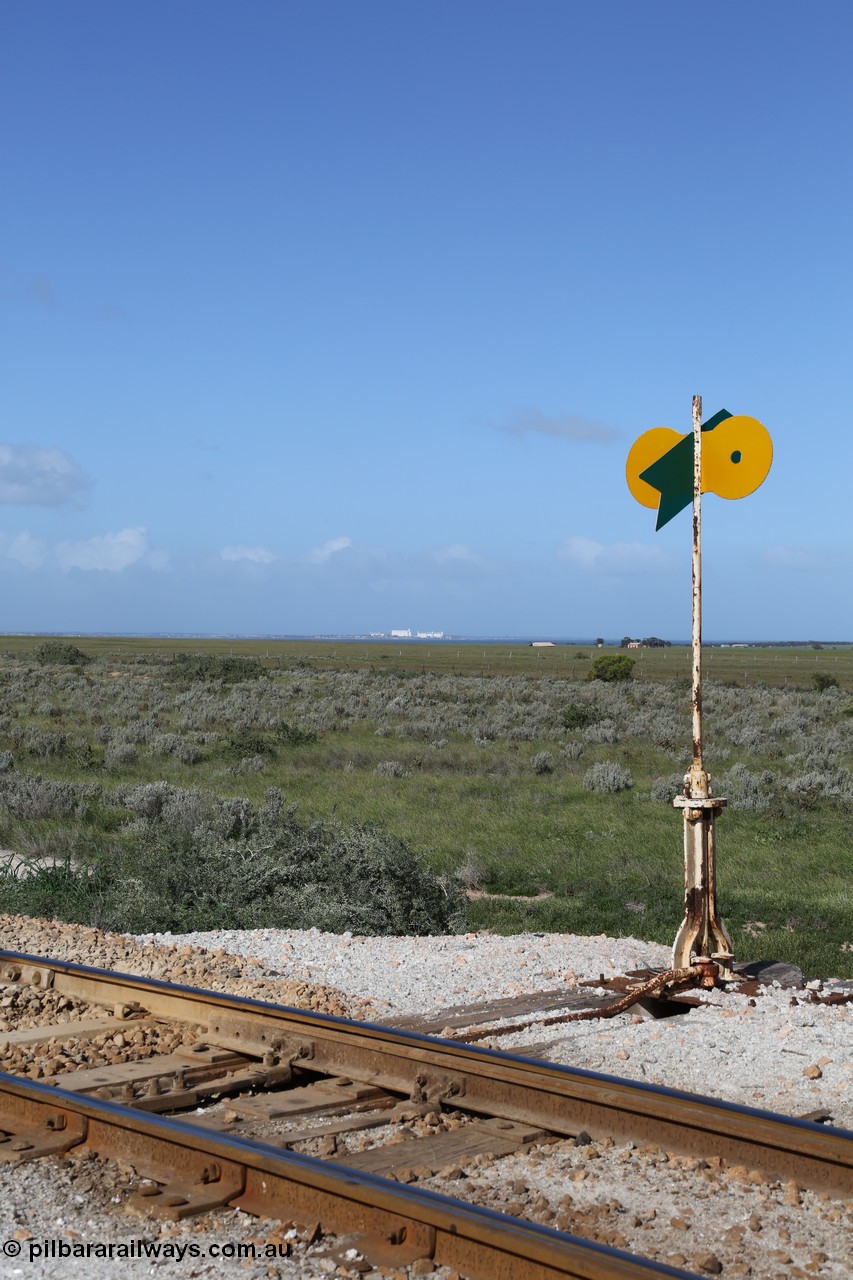 130704 0501
Moule, view of the point lever and indicator with the massive silo complex of Thevenard in the distance across the water, they are approximately 13 km away, [url=https://goo.gl/maps/ao6wATsRucn46d2c7]location here[/url]. 4th July 2013.
