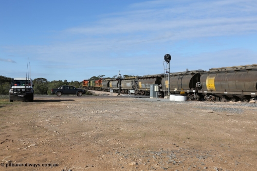 130704 0411
Kyancutta, south bound loaded grain train has stopped here to collect a loaded rack of grain waggons, seen here backing up to re-join the rest of the train on the mainline as it crosses the Eyre Highway grade crossing and one of only three electric signals on the network, behind EMD 1204 and twin ALCo 830 units 873 and 851. July 4, 2006.
