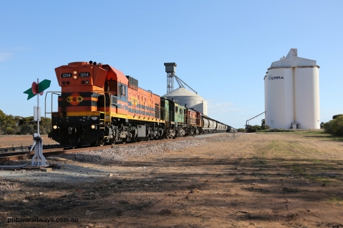 130704 0430
Kyancutta, 1200 class unit 1204 wearing current owner Genesee & Wyoming livery is a Clyde Engineering built EMD G12C model with serial 65-428 heads up a loaded grain train as it undertakes a brake test following shunting to attach a further fourteen waggons. July 4, 2006.
Keywords: 1200-class;1204;Clyde-Engineering-Granville-NSW;EMD;G12C;65-428;A-class;A1514;
