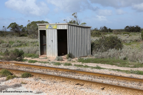 130704 0486
Moule, Mallee style shelter shed as a station 'building' of sorts. Moule was opened in February 1966 when the Direct Line between Ceduna and Kevin was opened. It hosts a crossing loop and ballast loading siding, [url=https://goo.gl/maps/KTtpy7LJB4tmHaTt6]Location is here[/url]. July 4, 2006.
