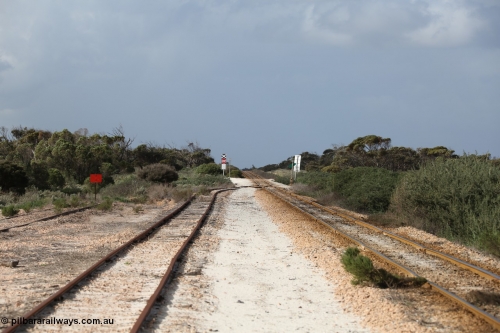 130704 0487
Moule, looking east, Moule located at the 445.6 km was opened in February 1966 when the Direct Line between Ceduna and Kevin was opened. From the left is the end of the ballast siding with the crossing loop rejoining the mainline just before the grade crossing to access the ballast stockpile area. [url=https://goo.gl/maps/KTtpy7LJB4tmHaTt6]Location is here[/url]. July 4, 2006.
