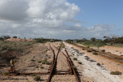 130704 0493
Moule, yard view looking east from the points for the single ended ballast siding with ballast pile of the left. Moule located at the 445.6 km was opened in February 1966 when the Direct Line between Ceduna and Kevin was opened. It hosts a crossing loop and ballast loading siding, [url=https://goo.gl/maps/14Xf9VRbSC6hkoQz5]Location is here[/url]. July 4, 2006.
