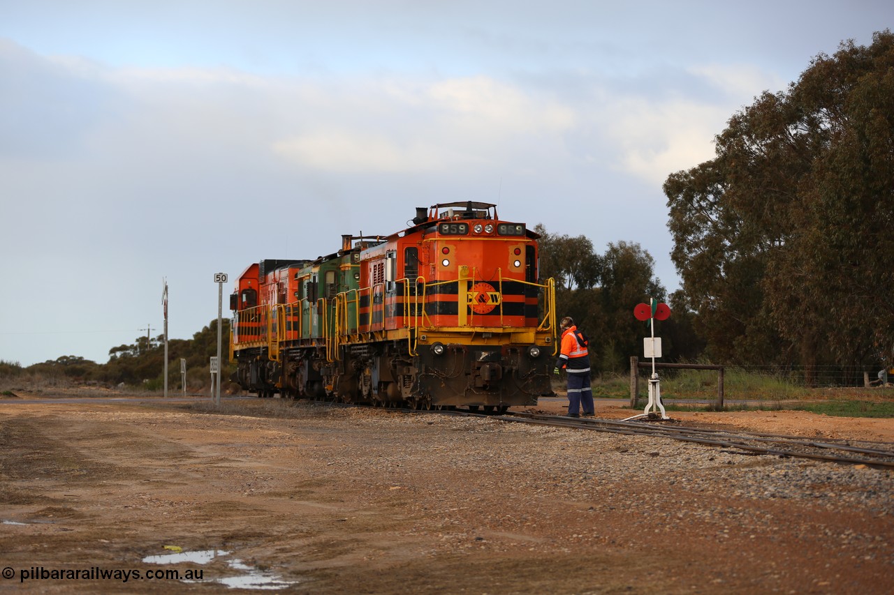130705 0587
Lock, having stowed the loaded portion on the mainline, the three locos 859, 846 and 1203 shunt back on to the empty portion on goods siding #1. 
Keywords: 830-class;859;AE-Goodwin;ALCo;DL531;84705;