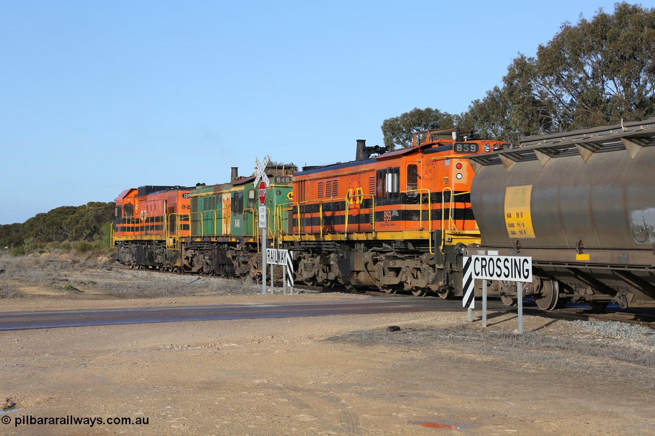 130705 0626
Lock, with loading finished, 1203 leads 846, 859 and the final portion out along the mainline out of goods siding #1 as it prepares to shunt back onto the loaded portion on the mainline for departure to Port Lincoln.
Keywords: 830-class;859;AE-Goodwin;ALCo;DL531;84705;