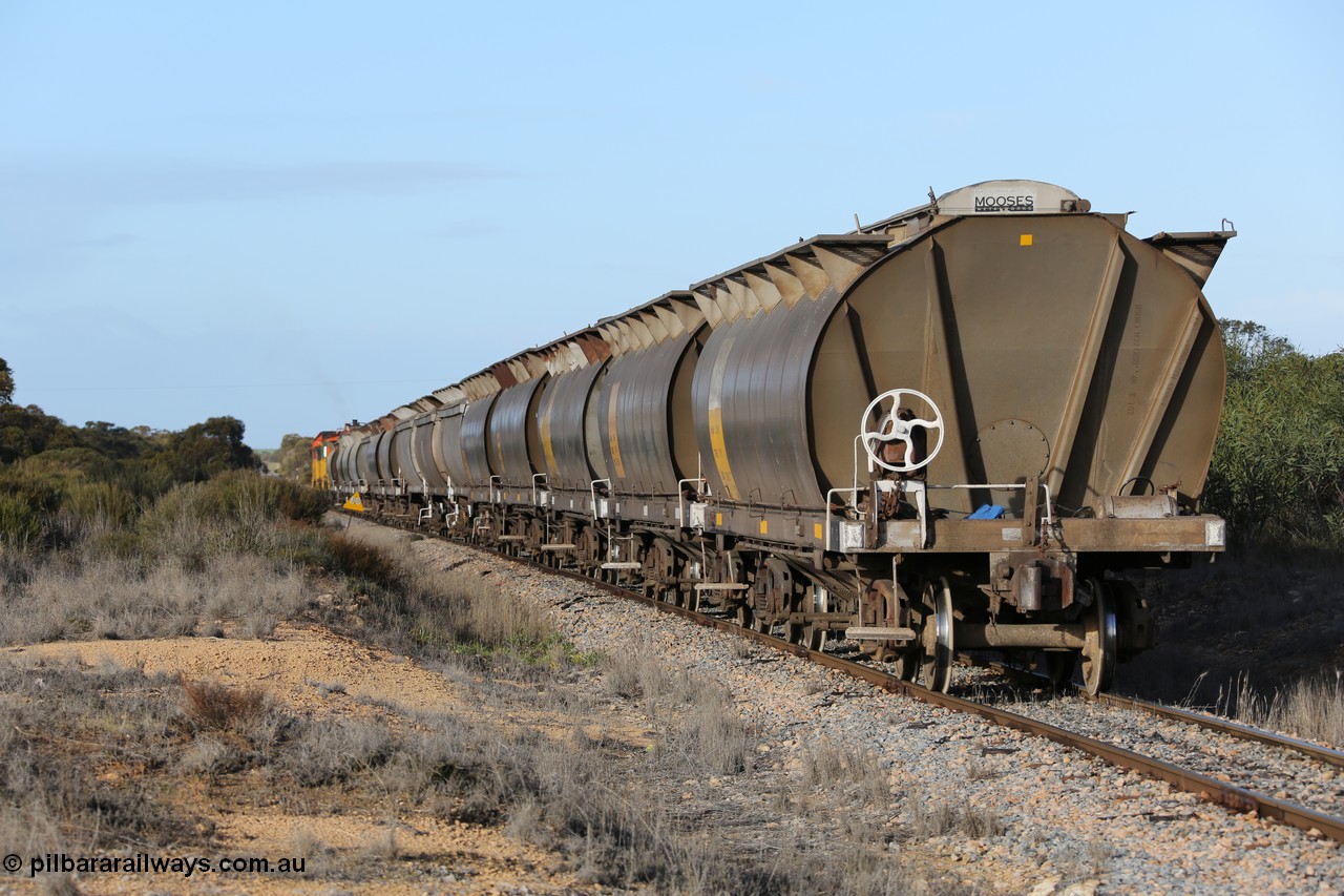 130705 0628
Lock, with loading finished, 1203 leads 846, 859 and the final portion out along the mainline out of goods siding #1 as it prepares to shunt back onto the loaded portion on the mainline for departure to Port Lincoln.
