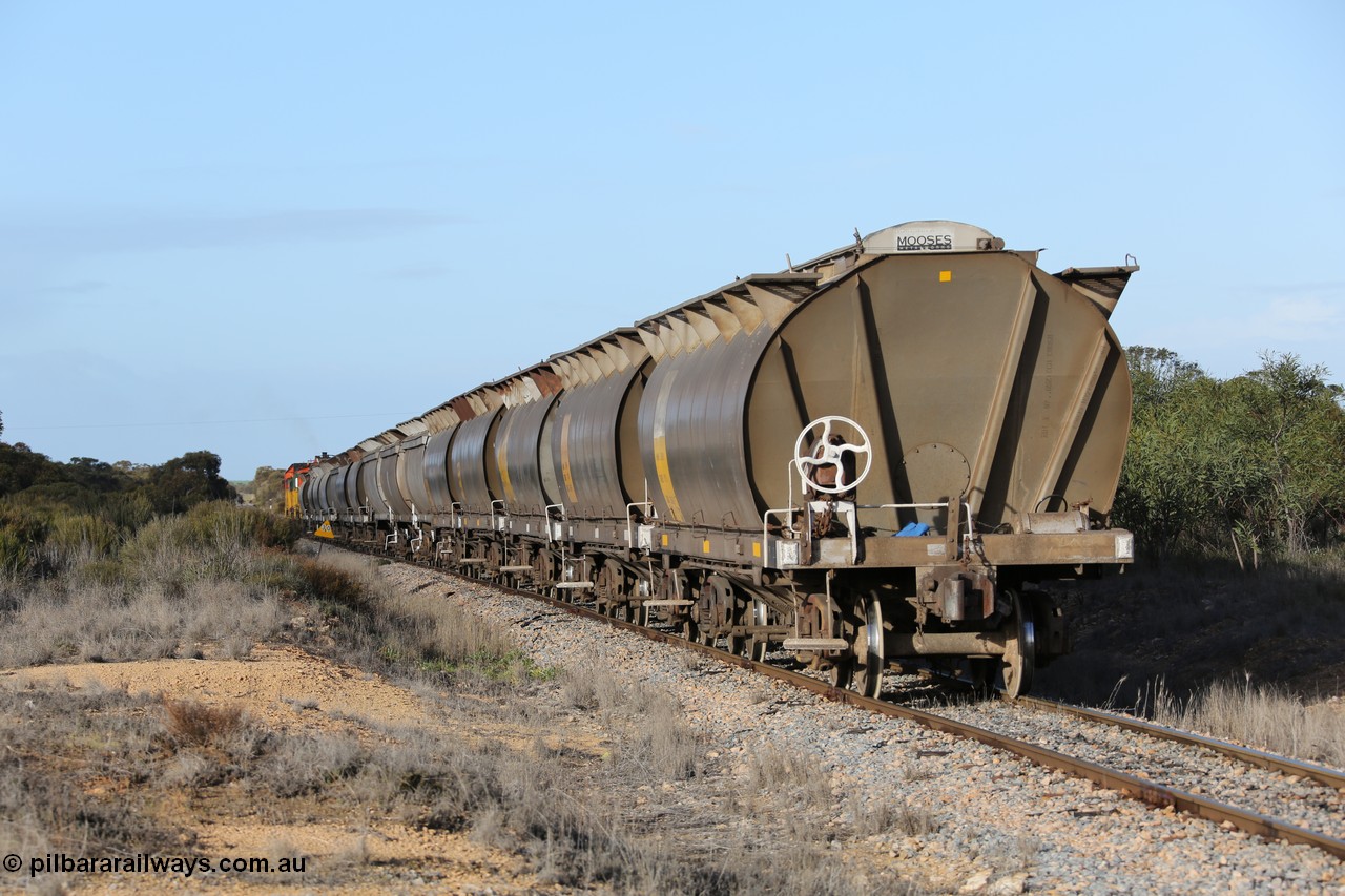 130705 0629
Lock, with loading finished, 1203 leads 846, 859 and the final portion out along the mainline out of goods siding #1 as it prepares to shunt back onto the loaded portion on the mainline for departure to Port Lincoln.
