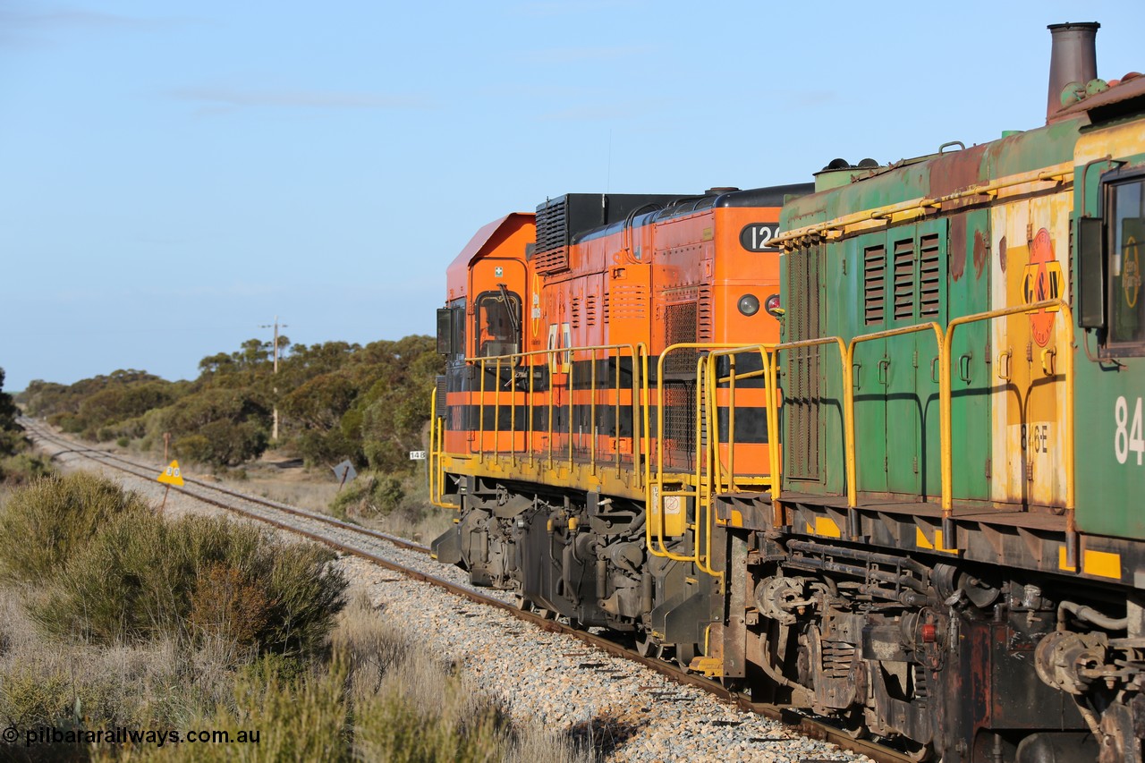 130705 0658
Lock, 1203, 846 and 859 depart along the mainline for Port Lincoln with the loaded grain train.
