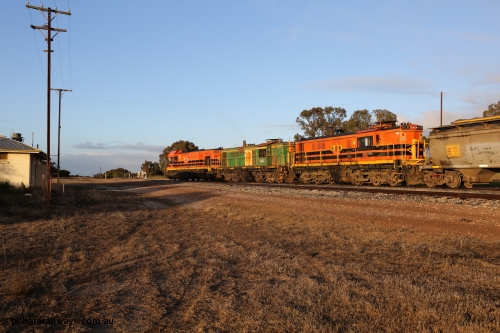 130705 0526
Lock, 1203, 846 and 859 shunt their loading grain train out of the siding onto the mainline. Genesee & Wyoming locomotive AE Goodwin ALCo model DL531 unit 859 'City of Port Lincoln' serial 84705, built in 1963, 859 started life at Peterborough, spent some years in Tasmania and even spent time in Perth on standard gauge in 2002 before being repainted and transferred to the Eyre Peninsula system in 2003. The barracks are just visible at left. July 5, 2013.
Keywords: 830-class;859;AE-Goodwin;ALCo;DL531;84705;