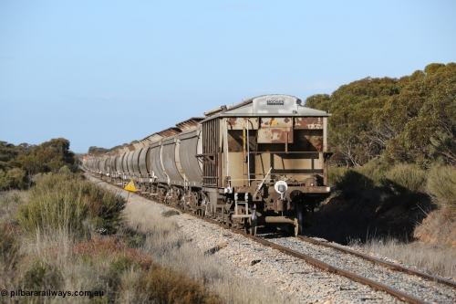 130705 0665
Lock, HBN type dual use ballast / grain hopper waggons, HBN 11 still with side gangways in place. One of seventeen built by South Australian Railways Islington Workshops in 1968 with a 25 ton capacity, increased to 34 tons in 1974. HBN 1-11 fitted with removable tops and roll-top hatches in 1999-2000. July 5, 2013.
Keywords: HBN-type;HBN11;1968/17-11;SAR-Islington-WS;