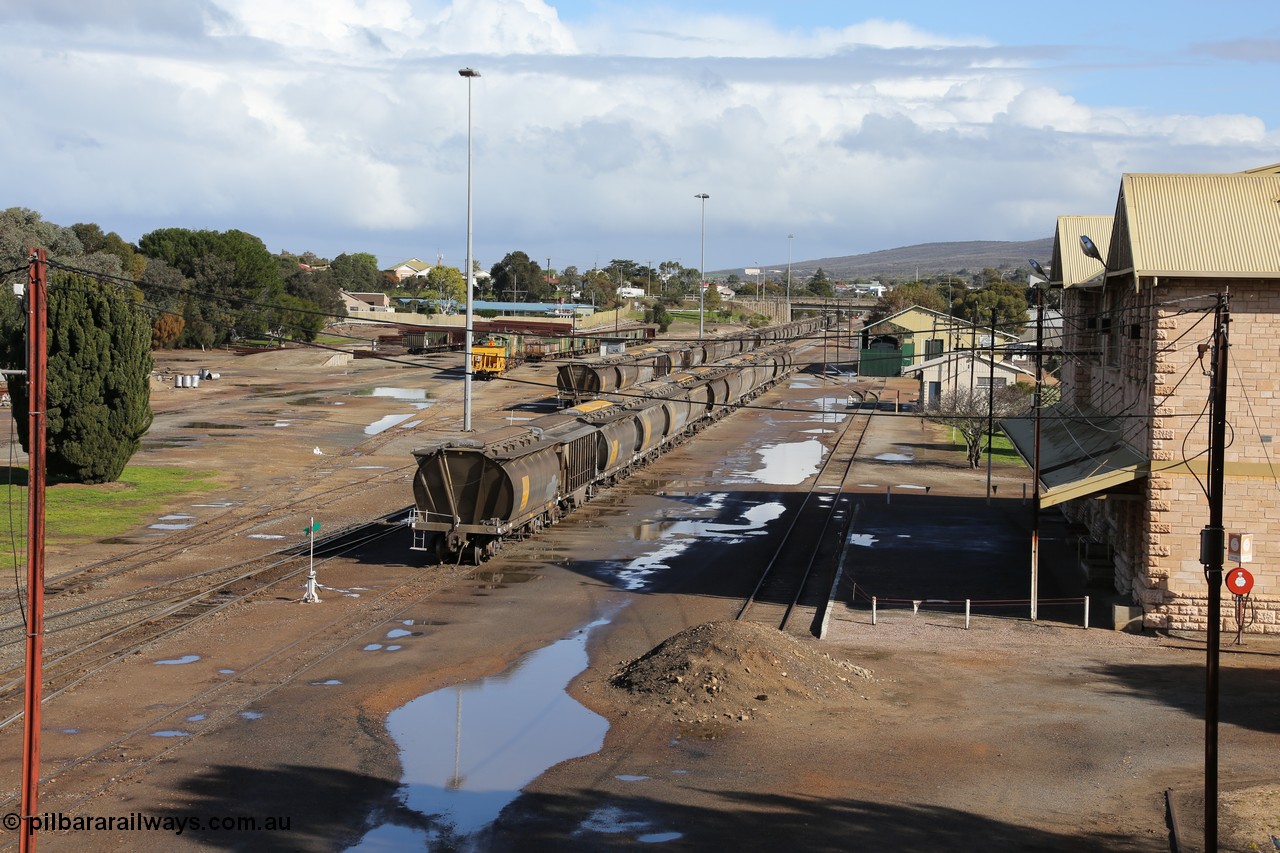 130706 0668
Port Lincoln, looking in the down direction from the London Street overbridge at the yard environs with the station at right which was Eyre Peninsula 'head offices'. 6th of July 2013.
