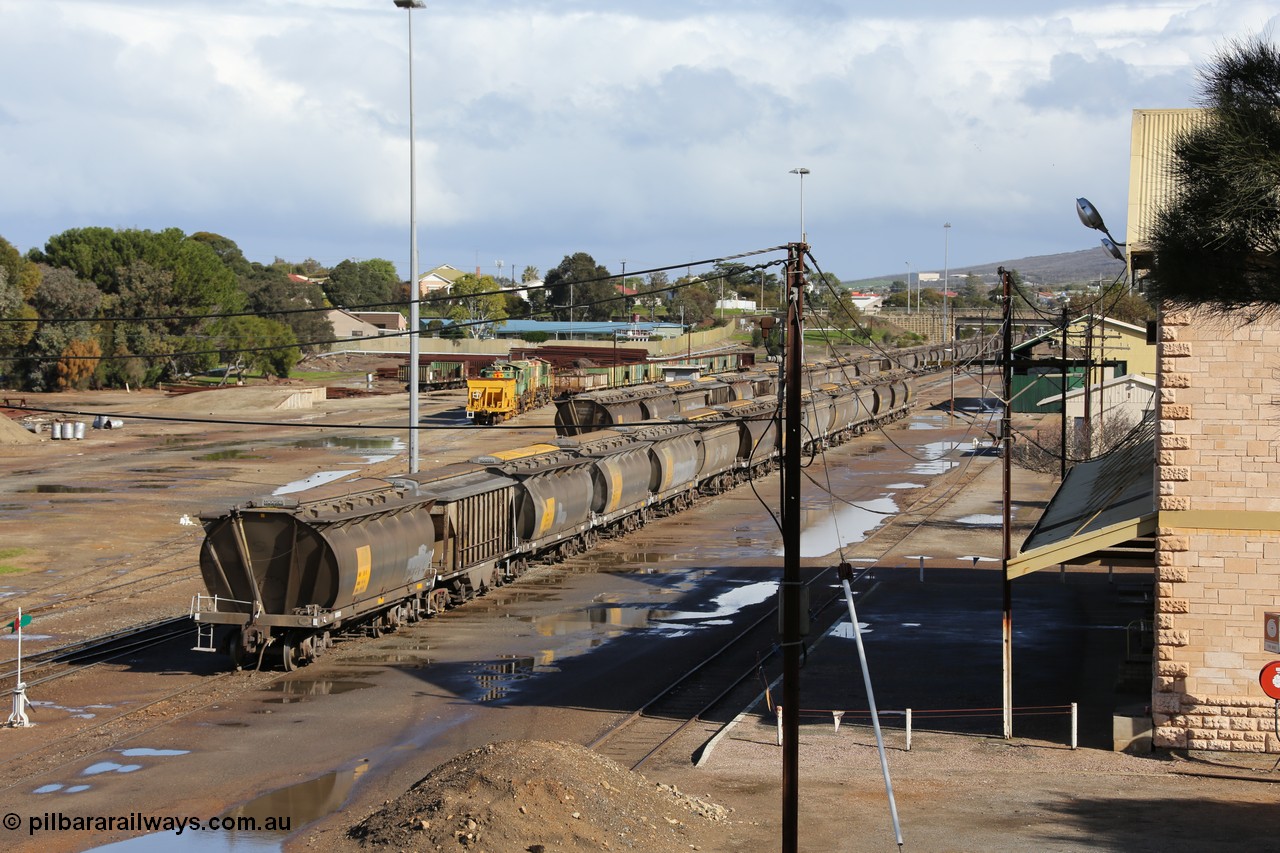 130706 0670
Port Lincoln, looking in the down direction from the London Street overbridge at the yard environs with the station at right which was Eyre Peninsula 'head offices'. 6th of July 2013.
