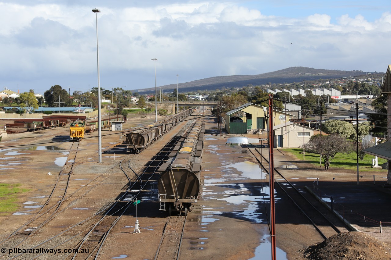 130706 0672
Port Lincoln, looking in the down direction from the London Street overbridge at the yard environs with the station at the extreme right, with the AN Freight Shed now museum in the middle background. 6th of July 2013.
