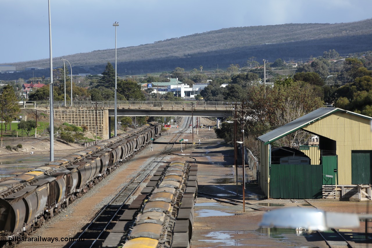 130706 0673
Port Lincoln, looking in the down direction from the London Street overbridge at the yard environs with the AN Freight Shed now museum on the right. The sign next to the point indicator states the Depot is Unattended. 6th of July 2013.
