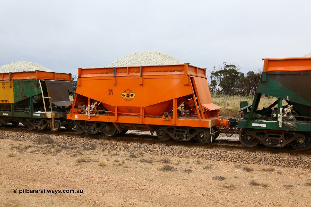 161109 1917
Moule, originally built by Kinki Sharyo as the NH type for the NAR in 1968, sent to Port Lincoln in 1978, then rebuilt and recoded ENH type in 1984, ENH 23, refurbished and wearing current owner Genesee & Wyoming orange with small decal with matching hungry boards loaded with gypsum.
Keywords: ENH-type;ENH23;Kinki-Sharyo-Japan;NH-type;