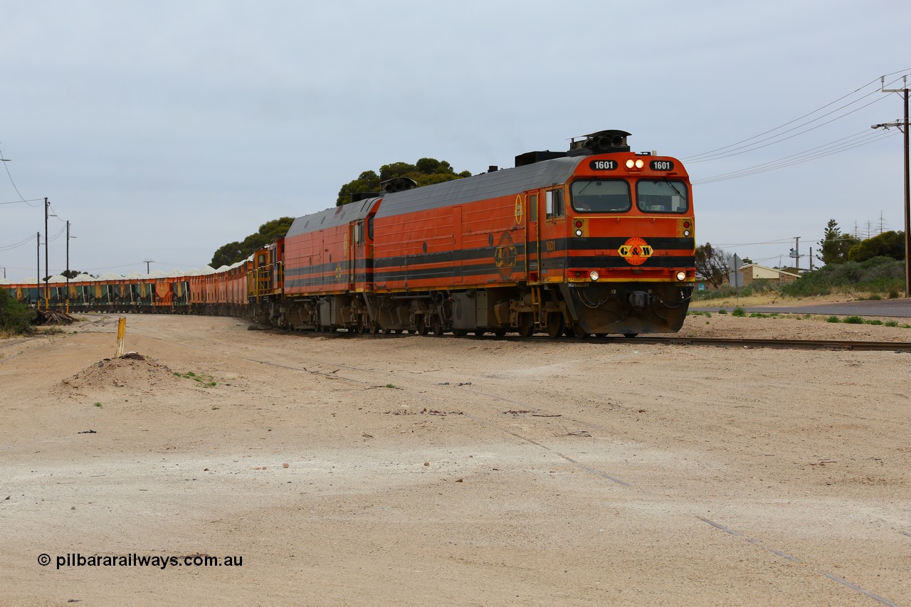 161109 1968
Thevenard, train 4DD4 enters the yard behind Genesee & Wyoming locomotives Clyde Engineering EMD model JL22C unit 1601 serial 71-728 and 1603 serial 71-730 as they negotiate the yard to the GRA siding balloon for unloading.
Keywords: 1600-class;1601;Clyde-Engineering-Granville-NSW;EMD;JL22C;71-728;NJ-class;NJ1;