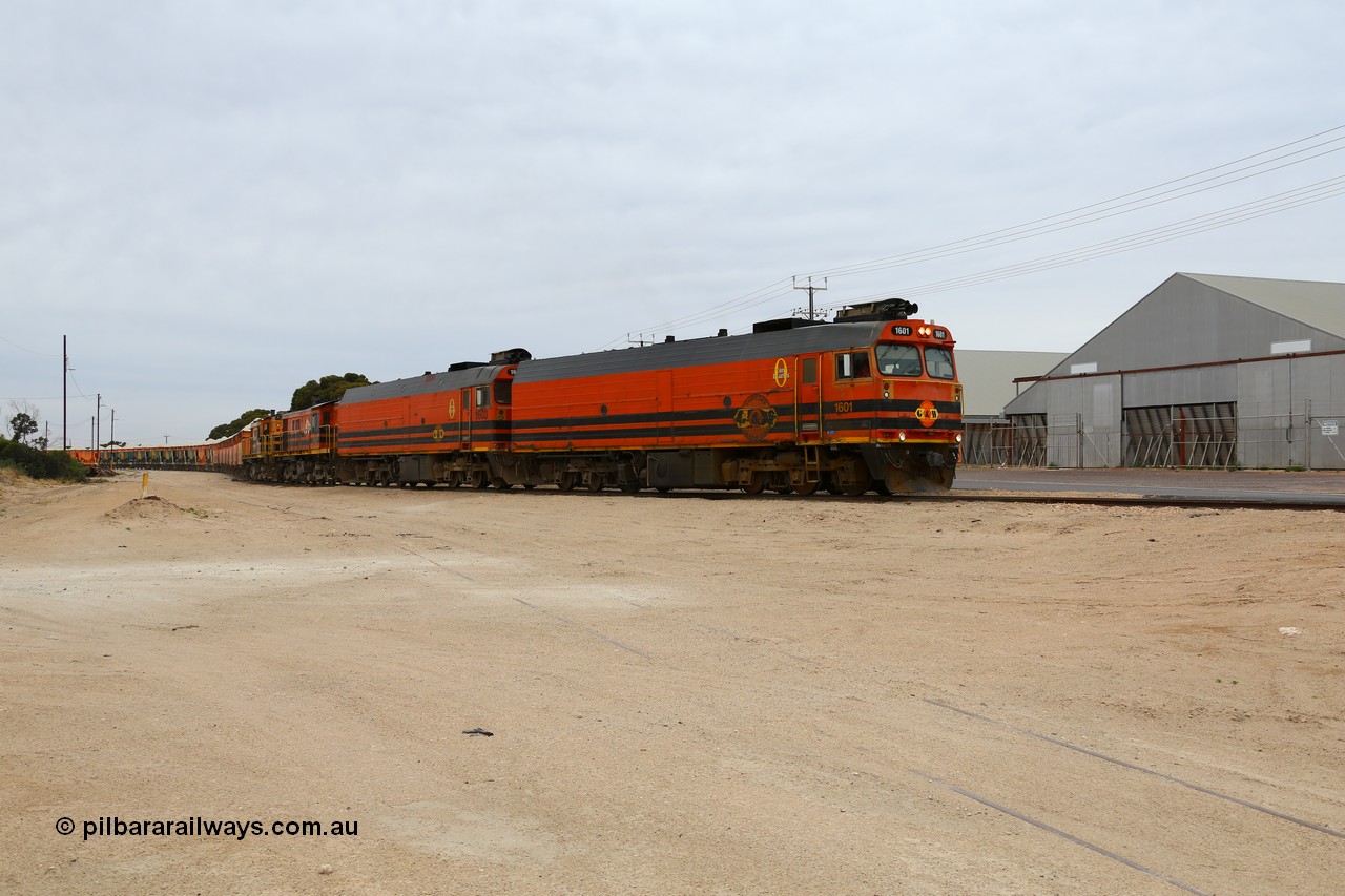 161109 1970
Thevenard, train 4DD4 enters the yard behind Genesee & Wyoming locomotives Clyde Engineering EMD model JL22C unit 1601 serial 71-728 and 1603 serial 71-730 as they negotiate the yard to the GRA siding balloon for unloading.
Keywords: 1600-class;1601;Clyde-Engineering-Granville-NSW;EMD;JL22C;71-728;NJ-class;NJ1;