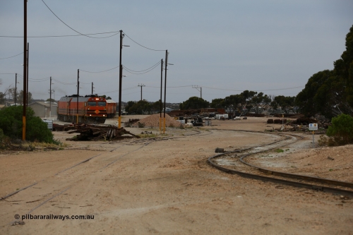 161109 1963
Thevenard, train 4DD4 enters the yard behind Genesee & Wyoming locomotives Clyde Engineering EMD model JL22C unit 1601 serial 71-728 and 1603 serial 71-730 as they negotiate the yard to the GRA siding balloon for unloading.
Keywords: 1600-class;1601;Clyde-Engineering-Granville-NSW;EMD;JL22C;71-728;NJ-class;NJ1;