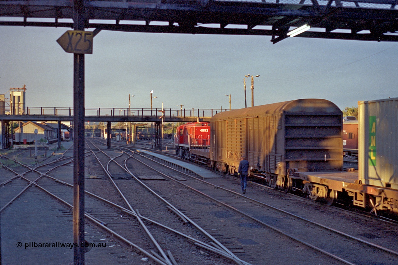 100-10
Albury station yard overview, NSWSRA standard gauge 48 class 4893 AE Goodwin ALCo model DL531 serial G3420-8, red terror livery, shunters float, shunts yard, shunter walking along, looking north, track on the diagonal to the left is broad gauge, diamond is at bottom of image. [url=https://goo.gl/maps/5A6DM4WuVq1zbsNRA]Geodata[/url].
Keywords: 48-class;4893;AE-Goodwin;ALCo;DL531;G3420-8;