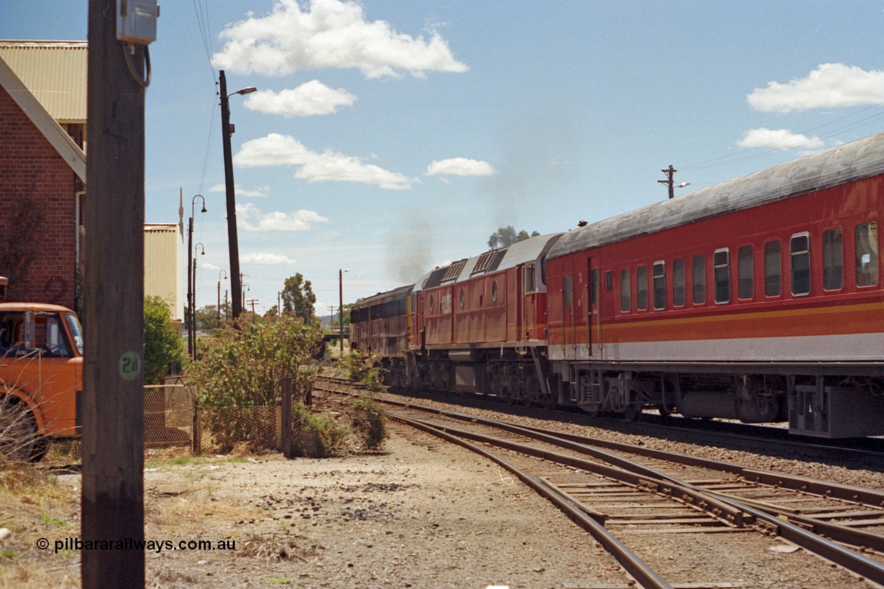 100-20
Albury yard, Wilson Street, NSWSRA standard gauge 44 class 4479 AE Goodwin ALCo model DL500B serial G3421-19 and 422 class 42205 Clyde Engineering EMD model J26C serial 69-660, candy livery, north bound Inter-Capital Daylight, trailing shot. [url=https://goo.gl/maps/GD6wj4qXeCg5BFzr7]Geodata[/url].
Keywords: 44-class;4479;AE-Goodwin;ALCo;DL500B;G3421-19;422-class;42205;Clyde-Engineering-Granville-NSW;EMD;J26C;69-660;