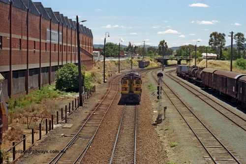 100-14
Albury yard, NSWSRA standard gauge 44 class 4479 AE Goodwin ALCo model DL500B serial G3421-19, readies for Inter-Capital Daylight banker duty, north end of yard looking north, from Wilson Street footbridge, signal post AY61, up shunting neck in the distance LHS, Dalgety's building on the left. [url=https://goo.gl/maps/nngpTA37VQekQpCt7]Geodata[/url].
Keywords: 44-class;4479;AE-Goodwin;ALCo;DL500B;G3421-19;