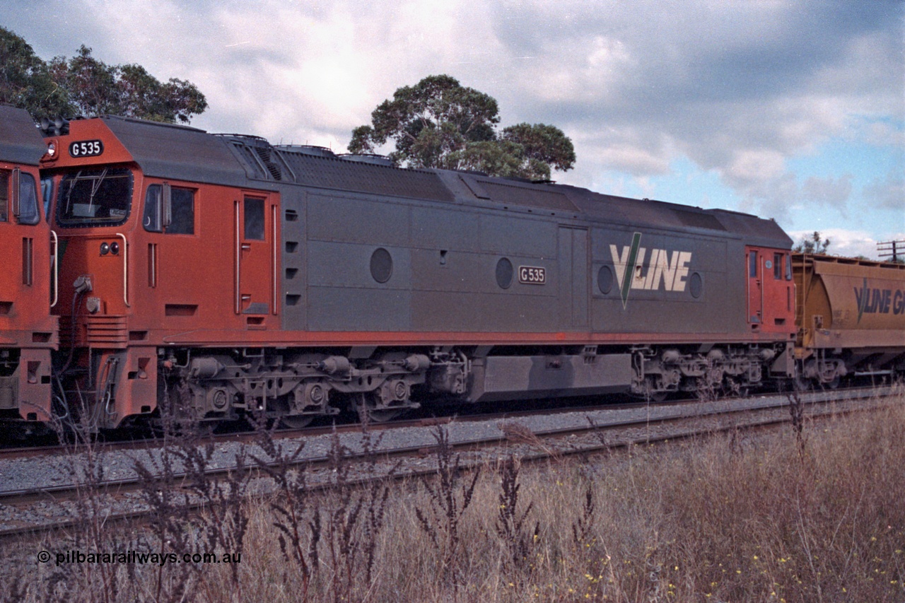 101-06
Maryborough, broad gauge V/Line G class G 535 Clyde Engineering EMD model JT26C-2SS serial 88-1265, 2nd unit, stabled grain train.
Keywords: G-class;G535;Clyde-Engineering-Somerton-Victoria;EMD;JT26C-2SS;88-1265;