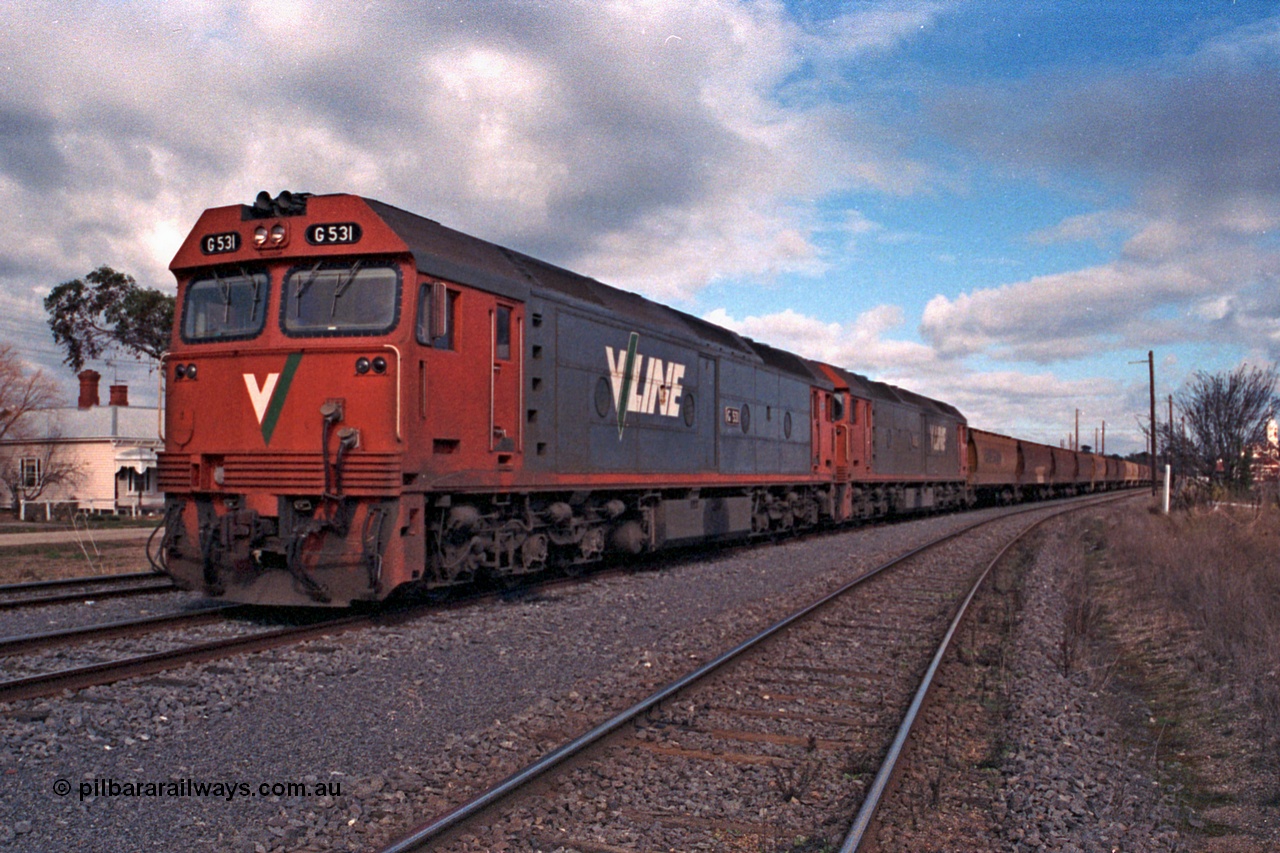 101-07
Maryborough, broad gauge V/Line G class G 531 Clyde Engineering EMD model JT26C-2SS serial 88-1261 and G 535 serial 88-1265, stabled grain train.
Keywords: G-class;G531;Clyde-Engineering-Somerton-Victoria;EMD;JT26C-2SS;88-1261;G535;88-1265;