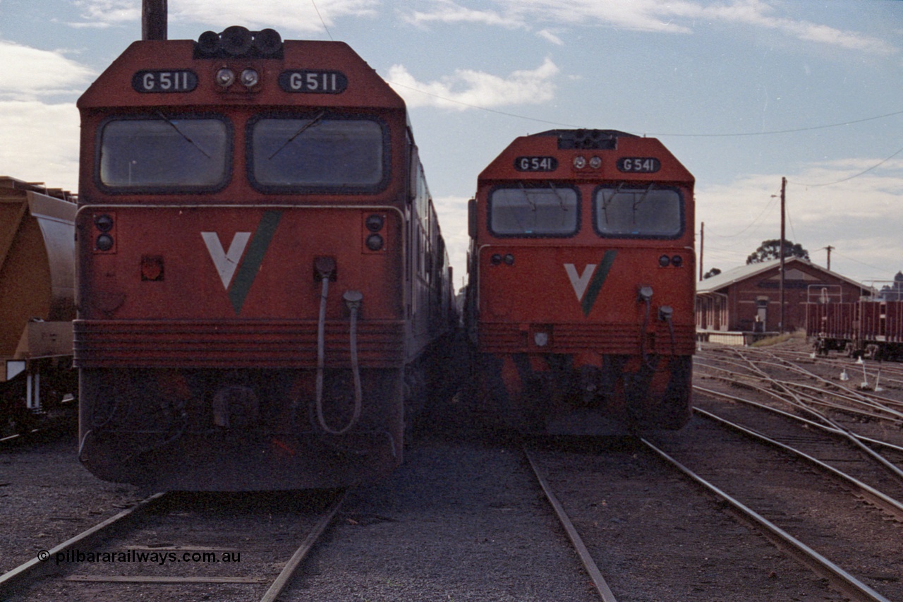 101-11
Maryborough, broad gauge V/Line G class leader G 511 Clyde Engineering EMD model JT26C-2SS serial 84-1239 and G 541 serial 89-1274 cab front, shows differences between 1st and 3rd series G class.
Keywords: G-class;G511;Clyde-Engineering-Rosewater-SA;EMD;JT26C-2SS;84-1239;G541;89-1274;