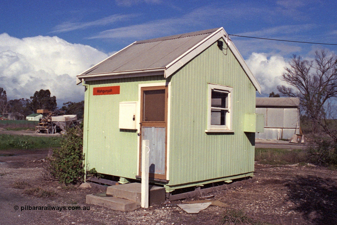 103-15
Wahgunyah portable station building, staff hut, 3/4 view, super phosphate shed and unloading contraption in the background.
